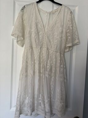 Cream Embroidered V‑Neck Mini Dress